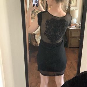 Form fitting little back dress with lacy inset